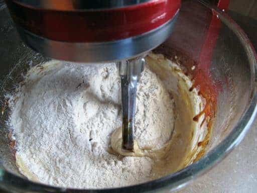 adding the flour mixture to the mixer