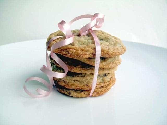 Stack of Chocolate Chunk Hazelnut Cookies with pink ribbon