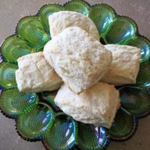Stack of Lemon Scones in a green glass egg plate