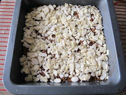 adding the almonds on top of baked mixture with toffee bits