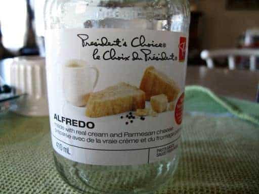 close up jar of alfredo sauce