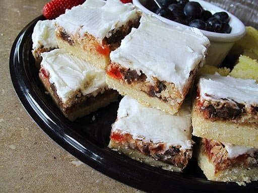 Stack of Chocolate Cherry Squares with White Icing on Top