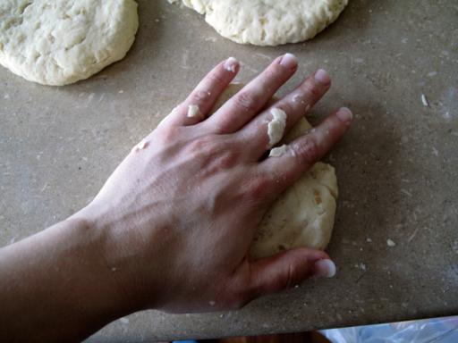 flattening the cut dough using hands