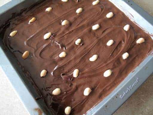 Tiger Bars in a baking pan top with nuts