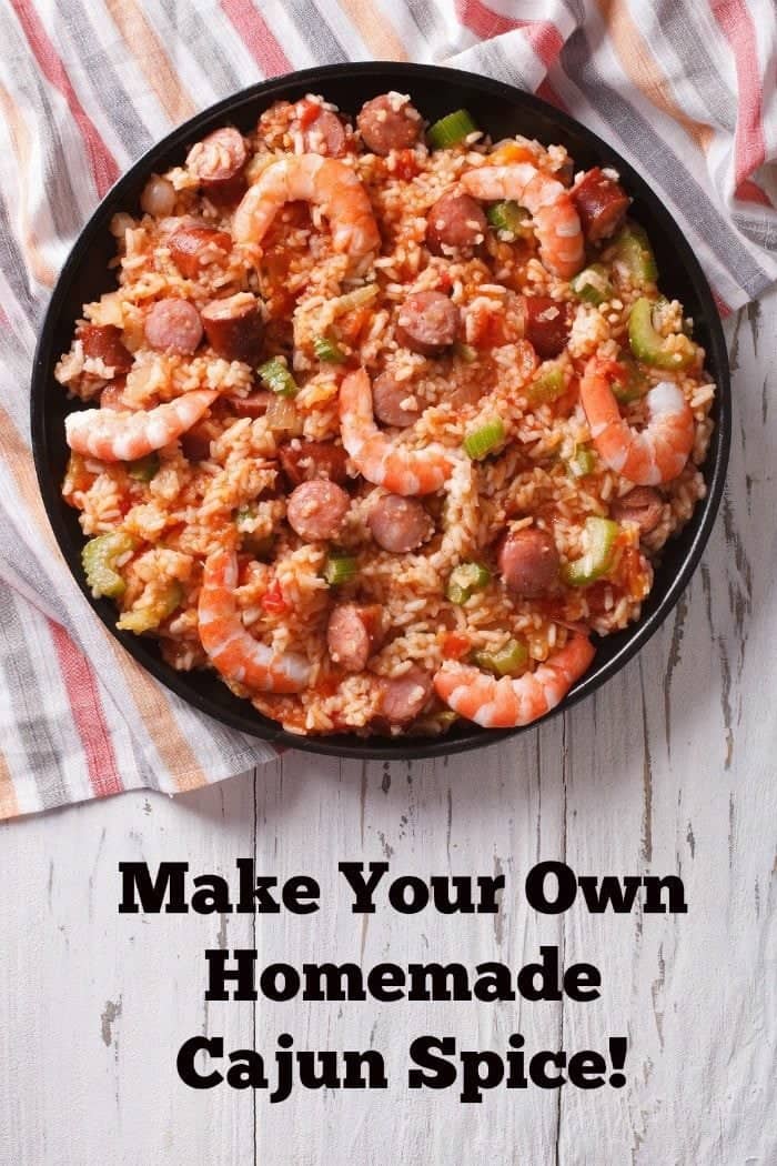 top down shot of Cajun Seasoning on Cajun fried rice with shrimps on a large bowl