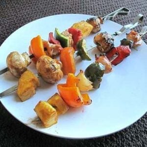 3 pieces of Sweet & Sour Chicken Shish Kabobsin a white plate