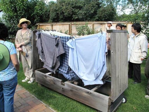 a wooden bench that folded out into a clothes line