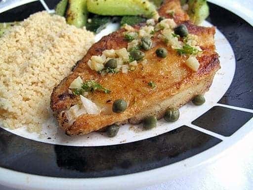 Pan Seared Halibut on a plate with couscous and vegetables
