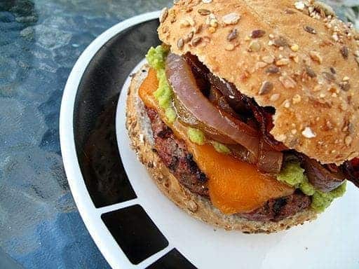 top down shot of homemade hamburger in a white plate with black pattern