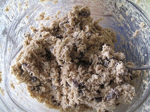 cookie dough with coconut, oatmeal and chocolate in a Pyrex container