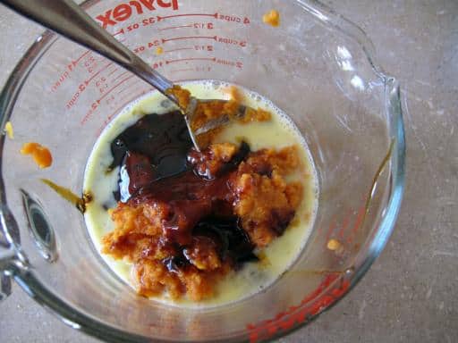 combining the beaten egg, molasses and pumpkin in a Pyrex measuring cup