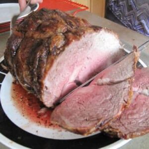 slicing the roasted prime rib