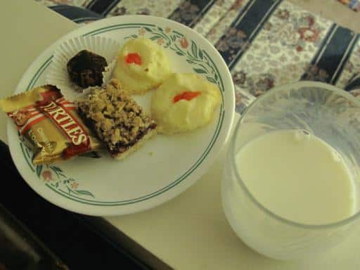 a plate of dinner and a glass of milk