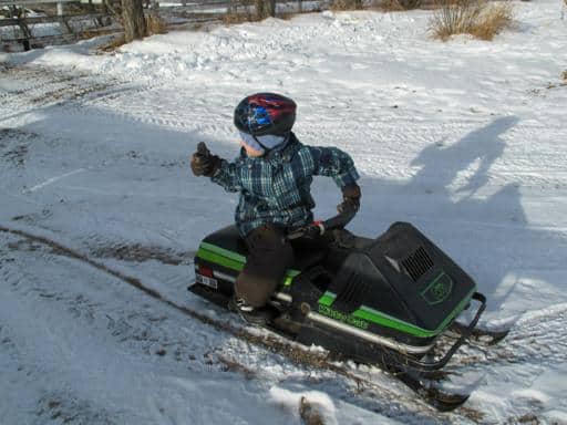 little boy driving the Ski-Doo