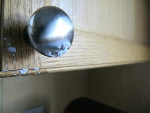 icing sugar on the cabinet knob