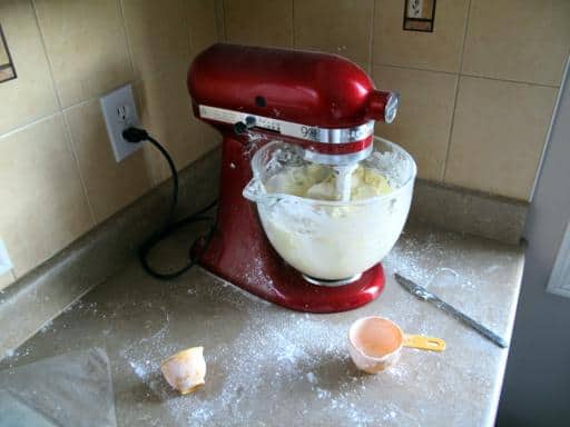 mixing icing in a red mixer