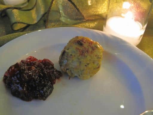 turkey meatball with spicy cranberry chutney in a white plate