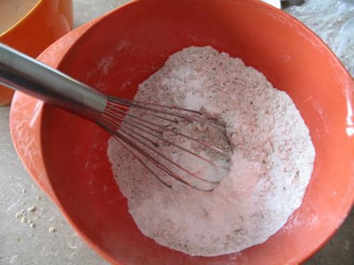 All dry ingredients whisked together in a large red bowl