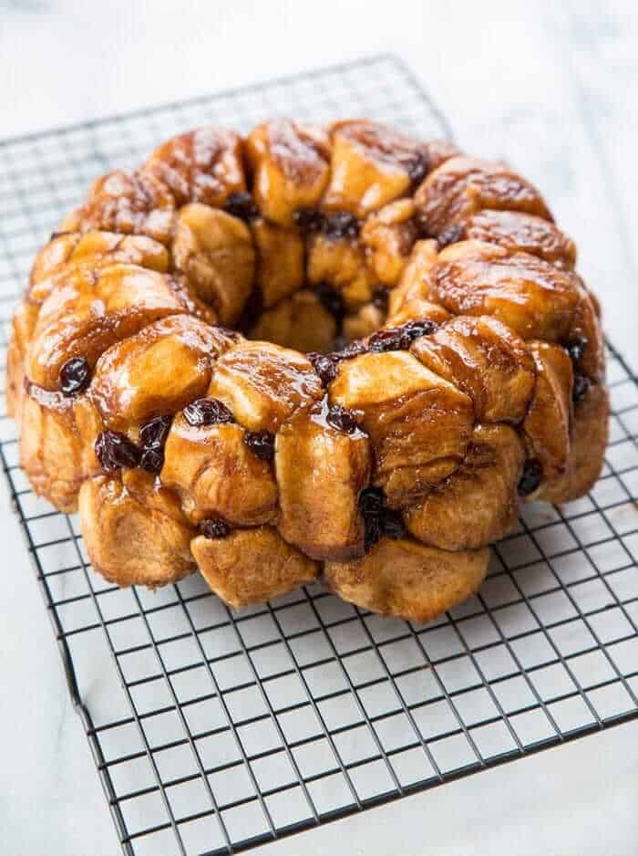Homemade Monkey Bread with raisins on a black wire rack