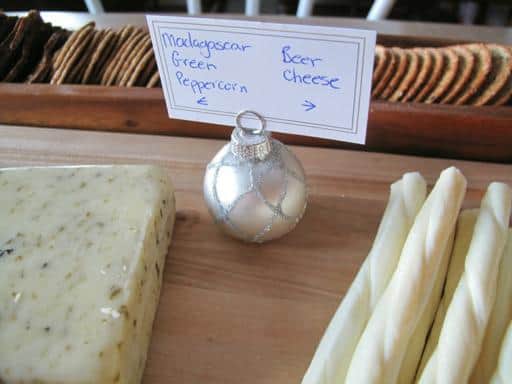 Christmas Ornament card holder with note in the middle of cheeses