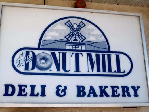 the Donut Mill Deli & Bakery signage