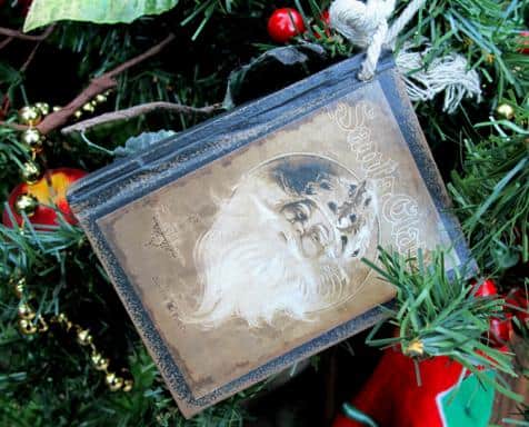 close up of blue Santa Card hanging in Christmas decor