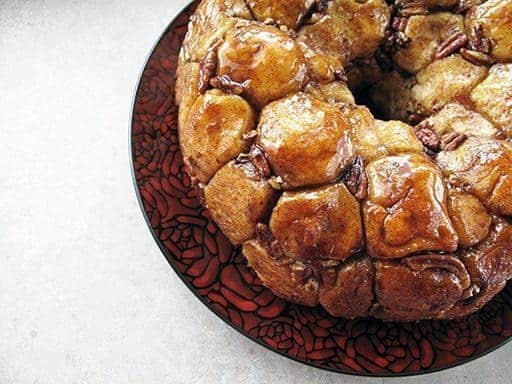 top down shot of a whole monkey bread in a red rose plate