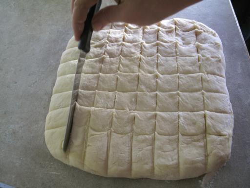 8x8 square of monkey bread dough cut into 62 pieces 