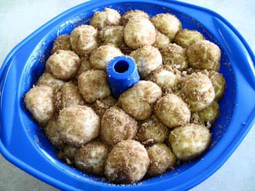 Monkey dough fully risen in a blue bundt pan