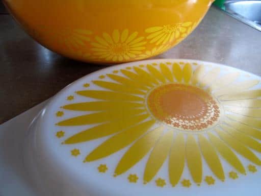 large orange Pyrex bowl and orange casserole cover