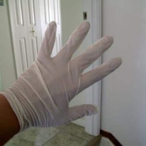 a hand with white gloves