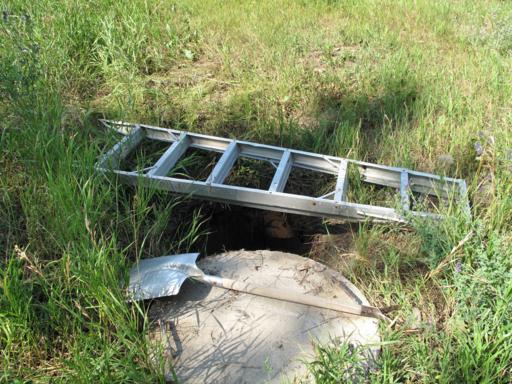 opened septic tank outside the house