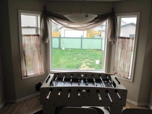 foosball table on the opposite side of the window