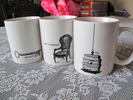 three pieces white mugs with Victorian motif