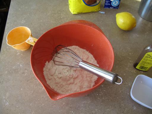 Whisking together the dry ingredients in a red bowl