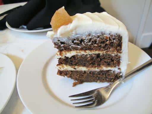 a slice of ginger cake with with vanilla icing