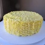 Ruffled Lemon Cake on a white cake holder