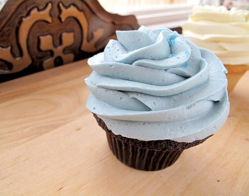 chocolate cupcake topped with blue icing