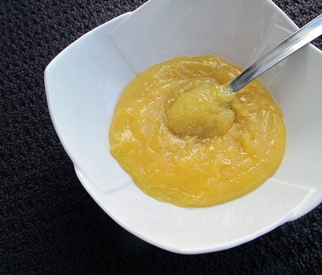 Lemon Cake Filling in a white bowl on black background