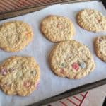 Baked Smartie Oatmeal Cookies in Cookie Sheets with Parchment Paper