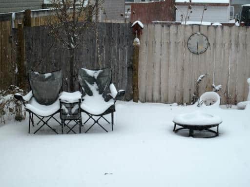 backyard partially covered with snow