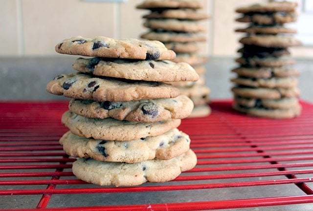 Stacks of Crispy Chocolate Chip Cookie in a Red Cooling Rack
