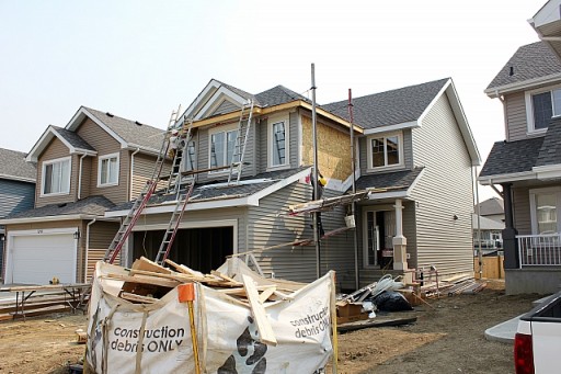 housefirstwalkthrough view from the outside of huge house under construction