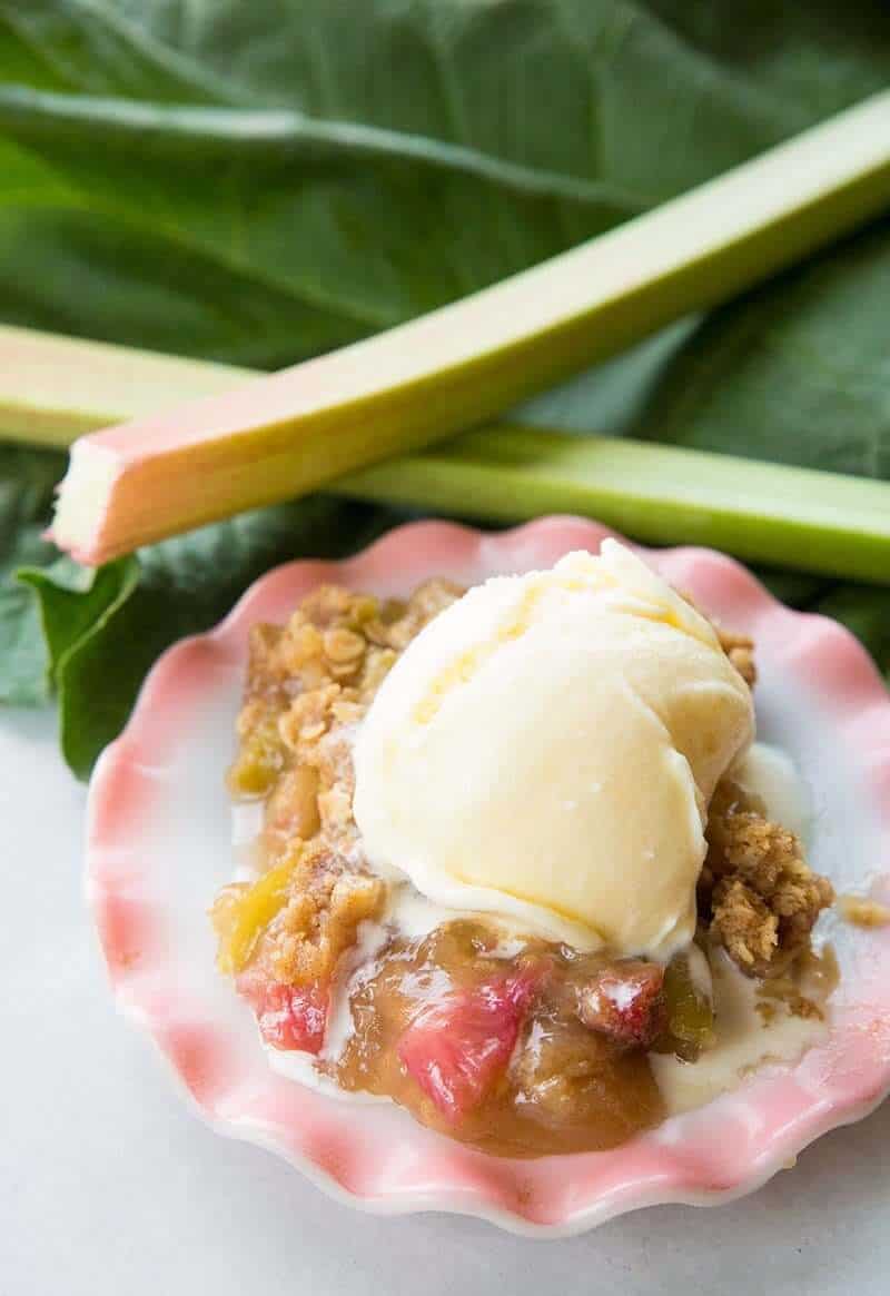 Rhubarb crisp with melting vanilla ice cream on top