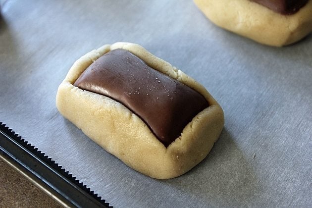 push the Butterfingers into the center of the cut dough