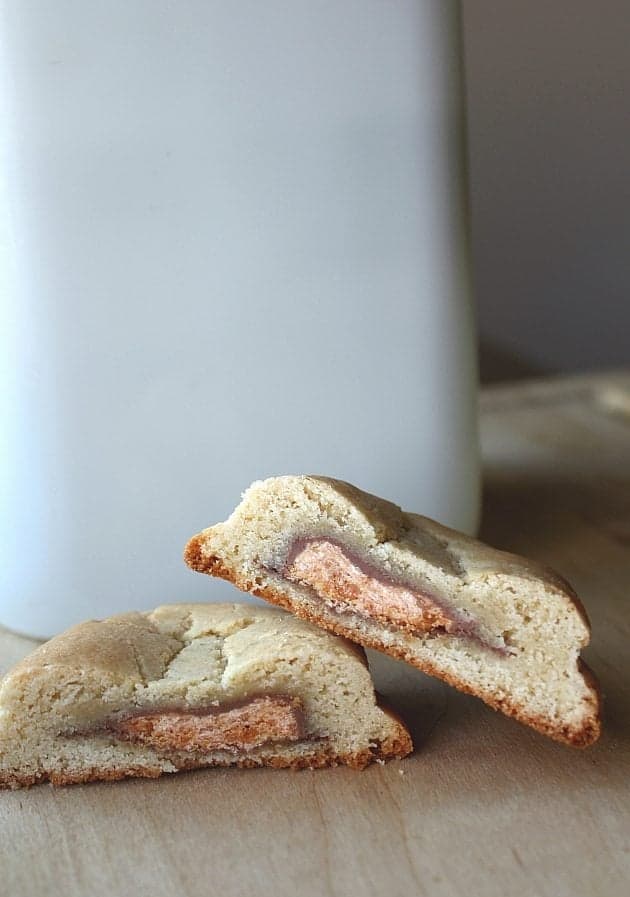 showing the inside of Butterfinger Stuffed Chocolate Chip cookie