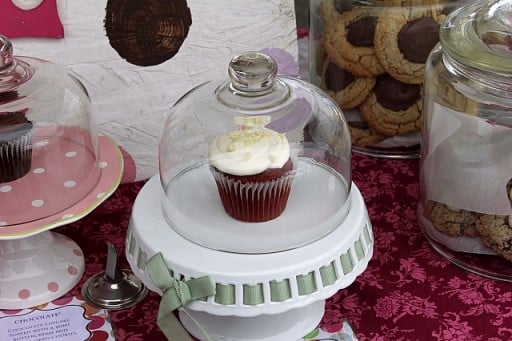 cupcake in a white cupcake stand with cover 