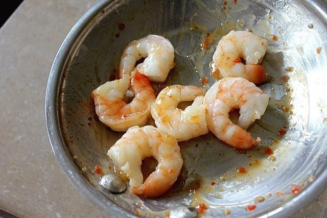pre-cooked shrimp tossed in a frying pan with as much sweet chili sauce