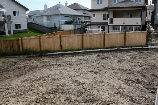 view of vacant backyard with fence