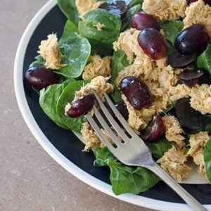 Curry Tuna Salad With Grapes in a bowl with fork